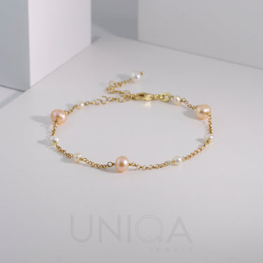 Bracciale con perle bicolore e catenina