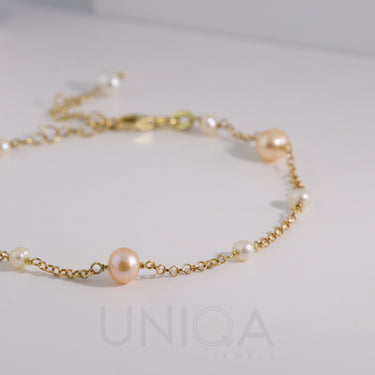 Bracciale con perle bicolore e catenina