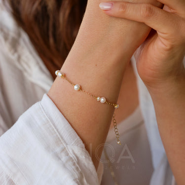 Bracciale con perle e catenina